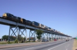 CSX intermodal transfer to UP Avondale in flight on the Huey Long Bridge